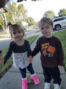 maggie holding hands with Will on a walk